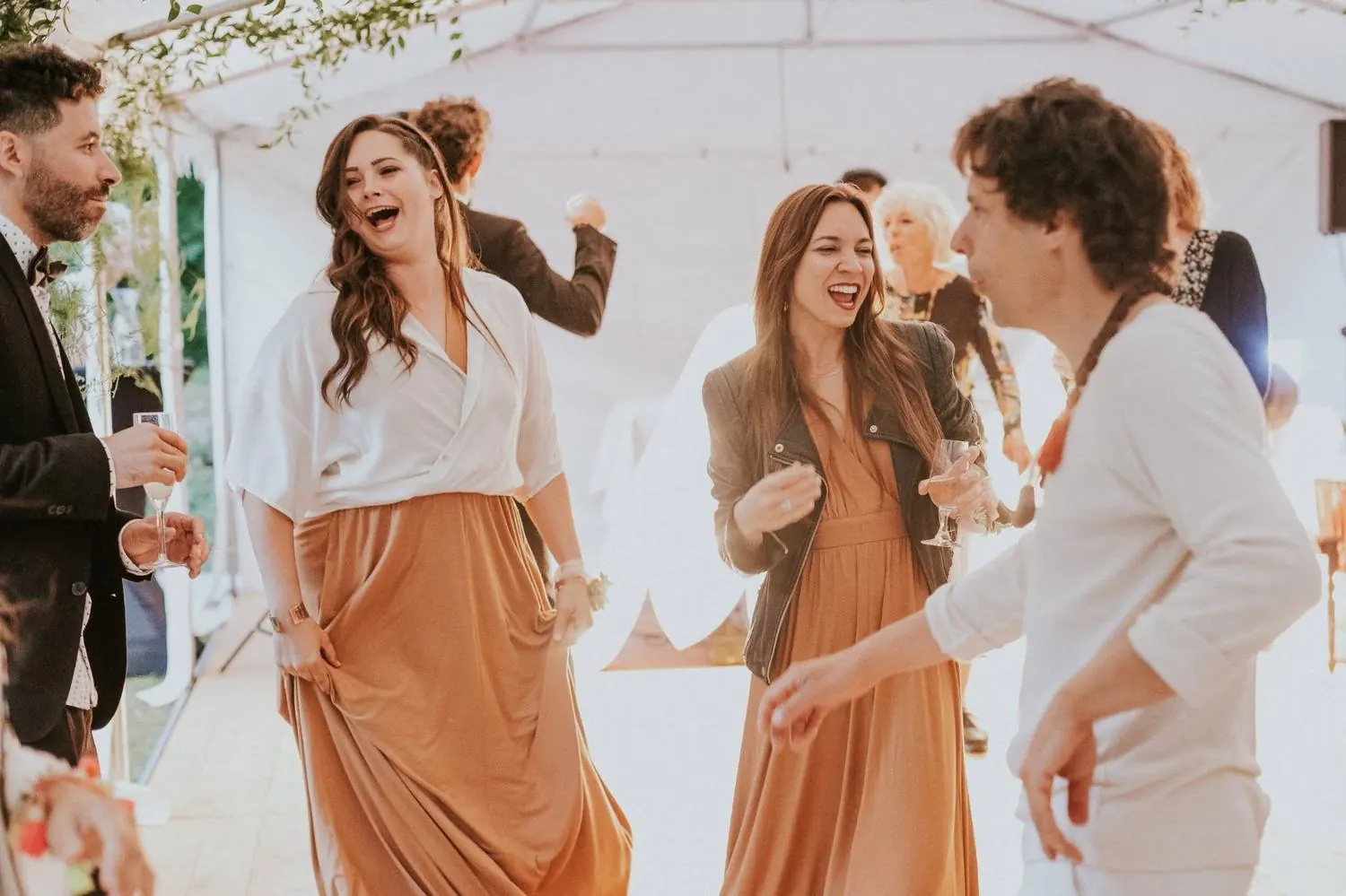 Guests laughing and dancing together
